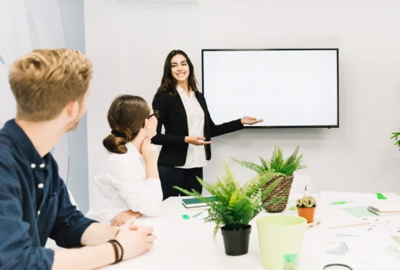 business-partners-looking-female-manager-giving-presentation