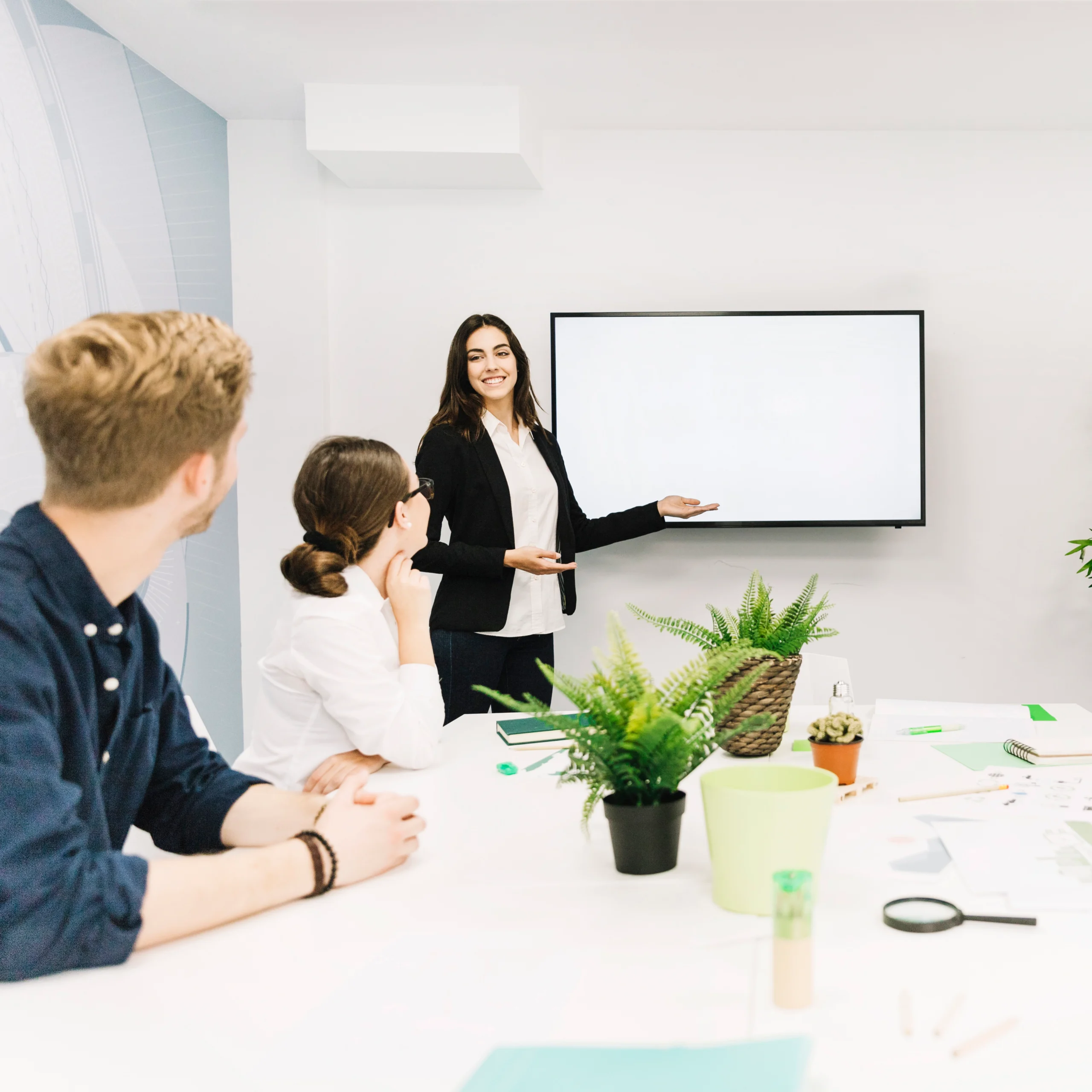 business-partners-looking-female-manager-giving-presentation