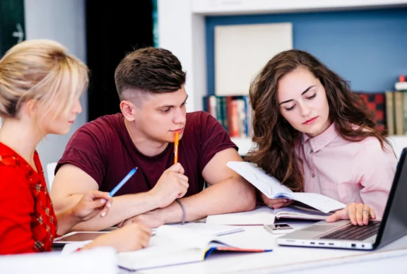 young-people-studying-using-laptop